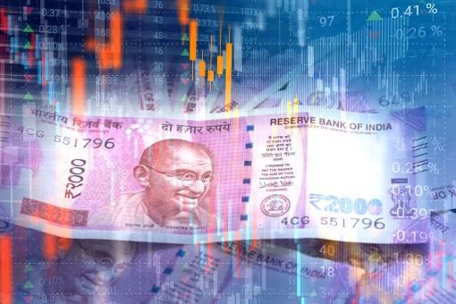 Indian Rupee paper currency on virtual interface of stock market data.